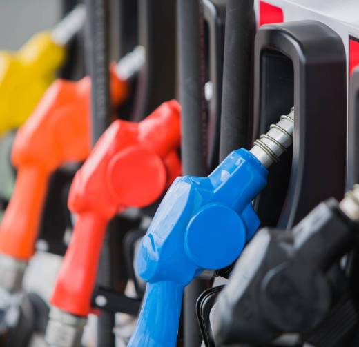 gas pump nozzles at station