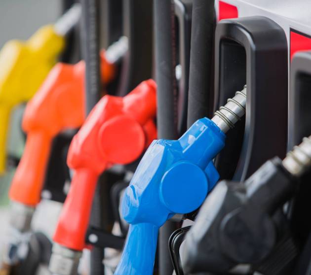 gas pump nozzles at station